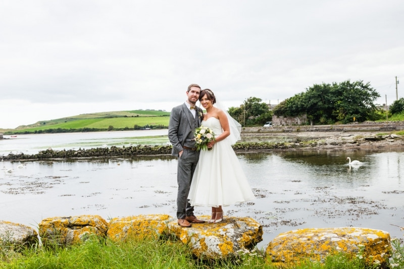 Bride and groom in front of the sea in Ring, Clonakilty