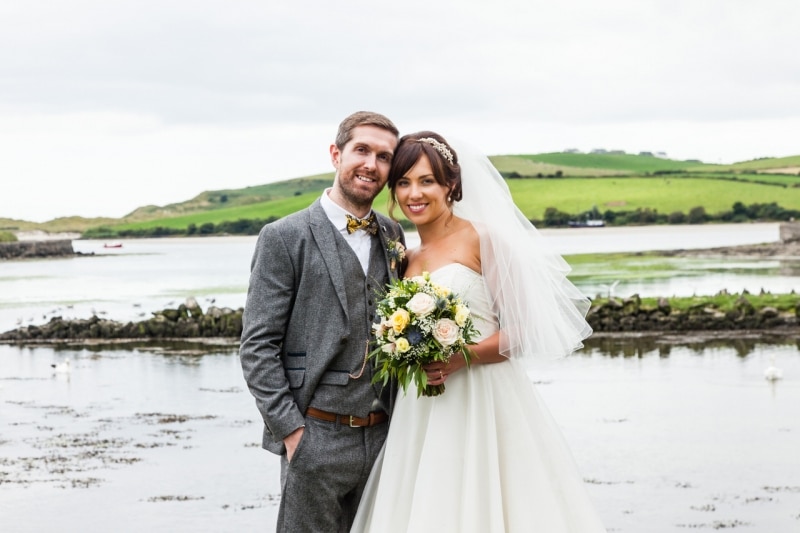 Close-up of Bride and groom in front of the sea in Ring, Clonakilty