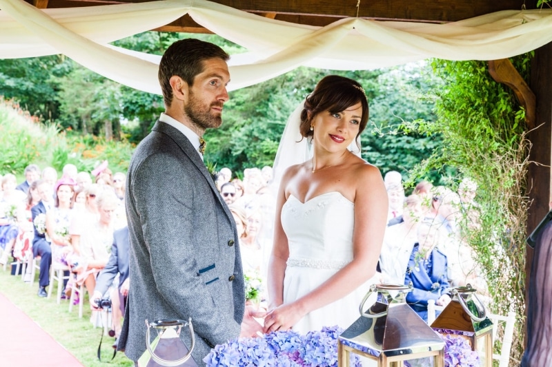 Bride and groom under the gazebo in Fernhill House Hotel