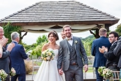 Bride and groom in front of gazebo after they are wed