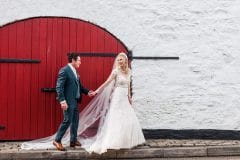Bride and groom in front of Kinsale store